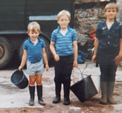 James on his family farm as a child