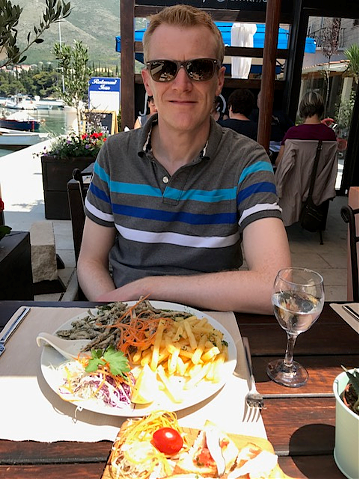 Richard enjoying a meal on holiday 