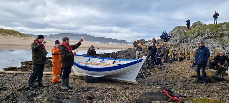 boat in strathnaver with people toasting