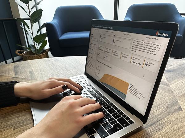 farrpoint digital intervention impact forecaster on laptop